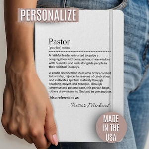 May include: A white notebook with the definition of "Pastor" and the name "Pastor Michael" is held by a person. The notebook has the text "PERSONALIZE" at the top and "MADE IN THE USA" at the bottom.