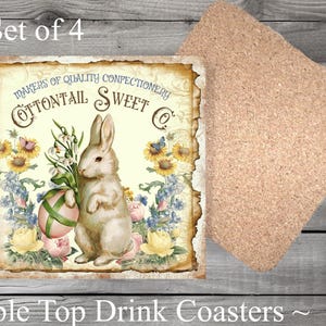 May include: Set of four 4x4 inch square drink coasters featuring a vintage illustration of a bunny rabbit holding an Easter egg with the text "MAKERS OF QUALITY CONFECTIONERY COTTONTAIL SWEET CO."