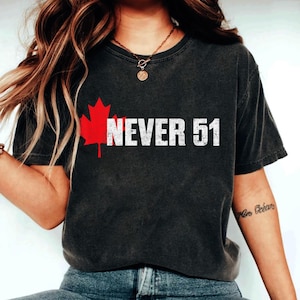 May include: A black t-shirt featuring a red maple leaf and the text "NEVER 51" in white.