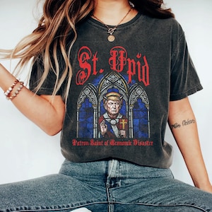St. Upid, Patron Saint of Economic Disaster _ ANTI-MAGA T-Shirt, Subtle Anti Trump Tee