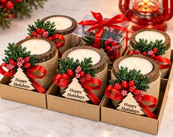 May include: A set of five candles in cylindrical wood-textured holders wrapped in twine. Each candle features a red ribbon, green pine sprigs, red berries, and a wooden tree-shaped tag with the text Happy Holidays printed in black.