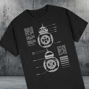 May include: A black t-shirt with a white design of a droid with the text "D47M4" and "D2-R4" on the front. The droid is labeled with different parts, including "POWER", "ARM", "HEAD", "LEG", "BODY", and "DRIVE".