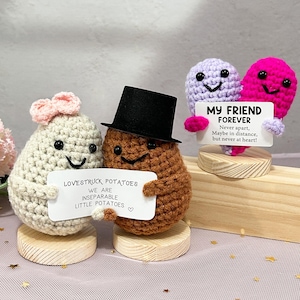 May include: A rustic wooden sign with the text "Welcome to our home" in white lettering. The sign features a distressed finish and a simple, inviting design, perfect for entryway decor.