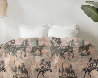 May include: A beige and brown duvet cover with a repeating pattern of cowboys riding horses and cacti. The duvet cover is on a bed with white pillows.