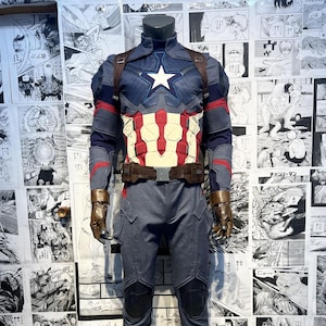 May include: A blue and red superhero costume with a star on the chest and a brown belt. The costume includes a long-sleeved jacket, pants, and boots.