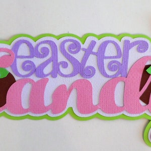 May include: Easter Candy banner with two brown bunny silhouettes, yellow wings, and green leaves. The words "Easter" in purple and "Candy" in pink are layered on a white background.