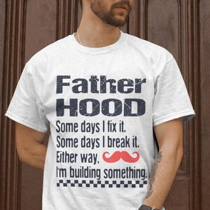 May include: White t-shirt with a black and white graphic that says "Father Hood" and "Some days I fix it. Some days I break it. Either way. I'm building something." with a red moustache graphic.