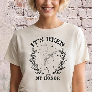 a woman wearing a t - shirt that says it's been my honor