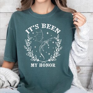 a woman wearing a t - shirt that says it's been my honor