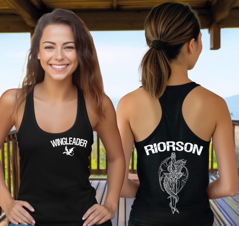 A woman wearing a black tank top with the text "WINGLEADER" and a graphic design on the back.