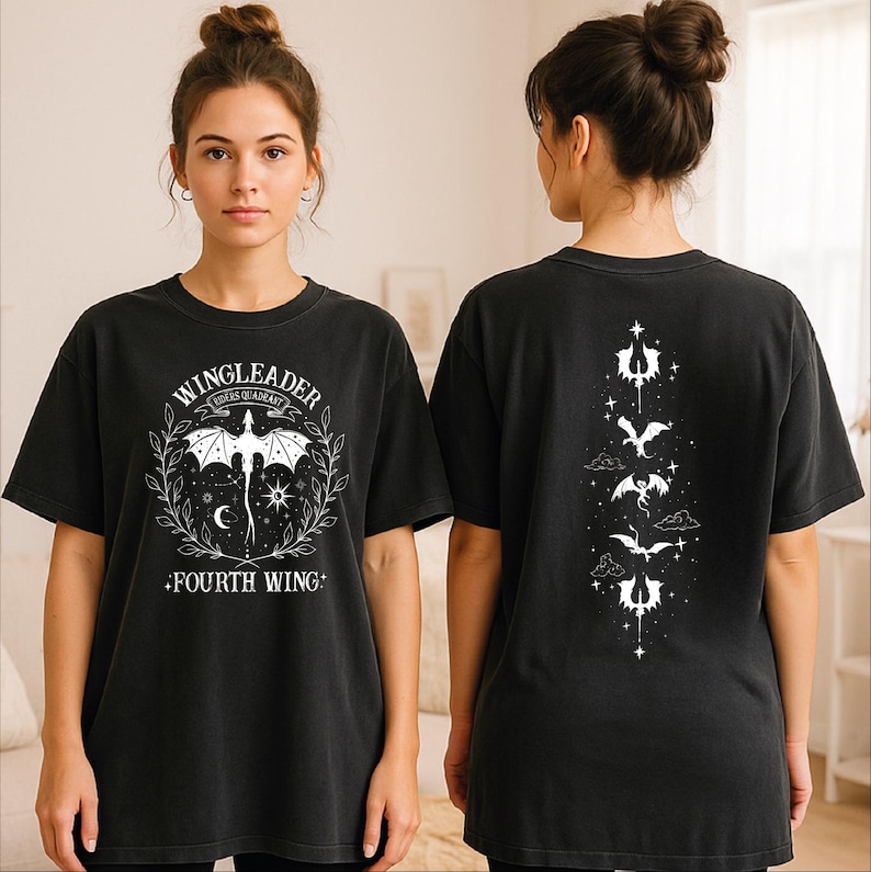 A woman wearing a black t-shirt with a graphic design on the front and back.