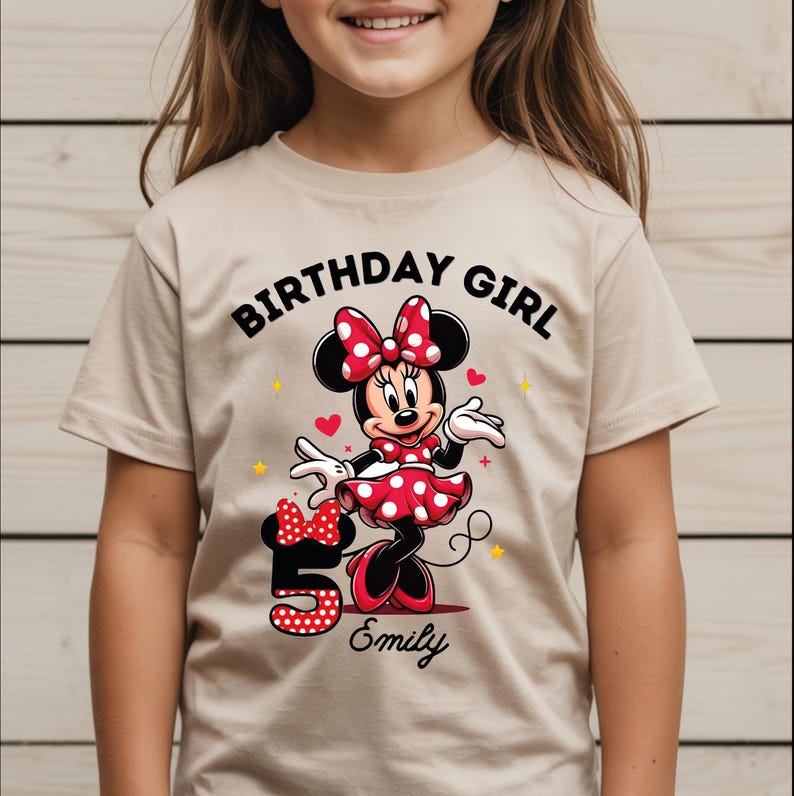 A young girl wearing a t-shirt with a Minnie Mouse design and the text "Birthday Girl Emily" printed on it.
