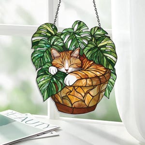 Orange katt med Monstera-solfångare, ljus akrylfönsterdekoration för kattmammor, växtälskare och bokmalar som älskar soliga, mysiga vibbar