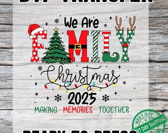 May include: DTF transfer with the text "DTF TRANSFER" at the top. The design features the words "We Are FAMILY Christmas 2025" with Christmas-themed graphics. The phrase "MAKING MEMORIES TOGETHER" is also included. The words "READY TO PRESS" are at the bottom.