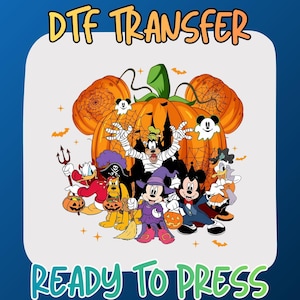 May include: A DTF transfer featuring a group of cartoon characters in Halloween costumes standing in front of a large orange pumpkin with spiderwebs. The text DTF TRANSFER and READY TO PRESS is printed in orange and green on a light background.