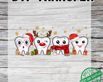 May include: DTF TRANSFER text above a design of four cartoon teeth dressed for Christmas. One tooth wears glasses and a Santa hat, another has reindeer antlers and a red nose, and the third wears a scarf. Presents and snowflakes are also in the design.