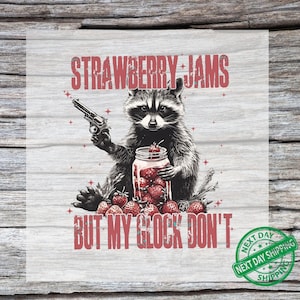 May include: A graphic featuring a raccoon holding a gun and a jar of strawberries. The text reads "STRAWBERRY JAMS BUT MY GLOCK DON'T". The image has a distressed, vintage style.