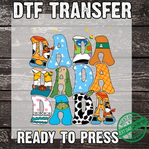 May include: DTF Transfer design with the word "DADA" in colorful, cartoon-style letters. The letters are decorated with various patterns and character designs. The text "READY TO PRESS" is at the bottom.