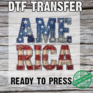 May include: A DTF transfer sheet featuring the word AMERICA in large block letters. The letters A, M, and E are filled with a blue star-patterned fabric texture, while R, I, C, and A feature red and white horizontal stripes. The text has a frayed, stitched edge effect.