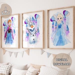 May include: Three framed watercolor prints featuring characters from the movie Frozen. The prints depict Anna, Olaf, and Elsa in front of a castle with purple and blue balloons. The frames are a light brown color. The words "DIGITAL DOWNLOAD" are in the bottom right corner.