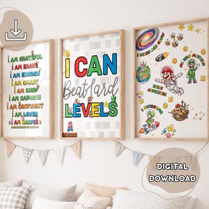 May include: Three framed prints with inspirational quotes and video game-themed illustrations. The prints feature phrases like "I AM GRATEFUL" and "I CAN Beat Hard LEVELS." The artwork includes characters and elements from a popular video game.