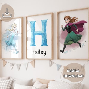 May include: Three framed prints featuring cartoon characters and a personalized initial. One print shows a character in a blue dress, another displays a blue letter "H" with the name "Hailey" below, and the third depicts a character in a green dress.