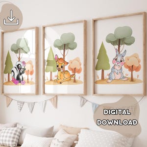 May include: Three printable nursery art prints featuring woodland animals. The prints feature a deer, a rabbit, and a skunk. Each print has a green, brown, and orange color scheme.