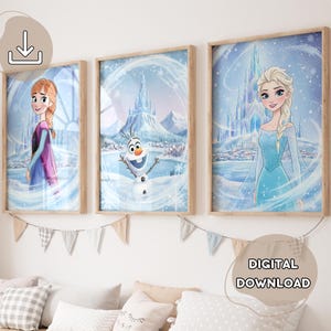 May include: Set of three framed art prints featuring characters from a popular animated film. The prints depict Anna, Elsa, and Olaf in a wintery scene with a castle and snowflakes. The artwork is in a watercolor style with soft colors.