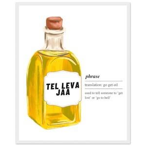 May include: A framed print featuring a yellow bottle with a cork stopper. The bottle contains a yellow liquid and has a white label with the text "TEL LEVA JAA". The text "phrase" and its translation are also included.