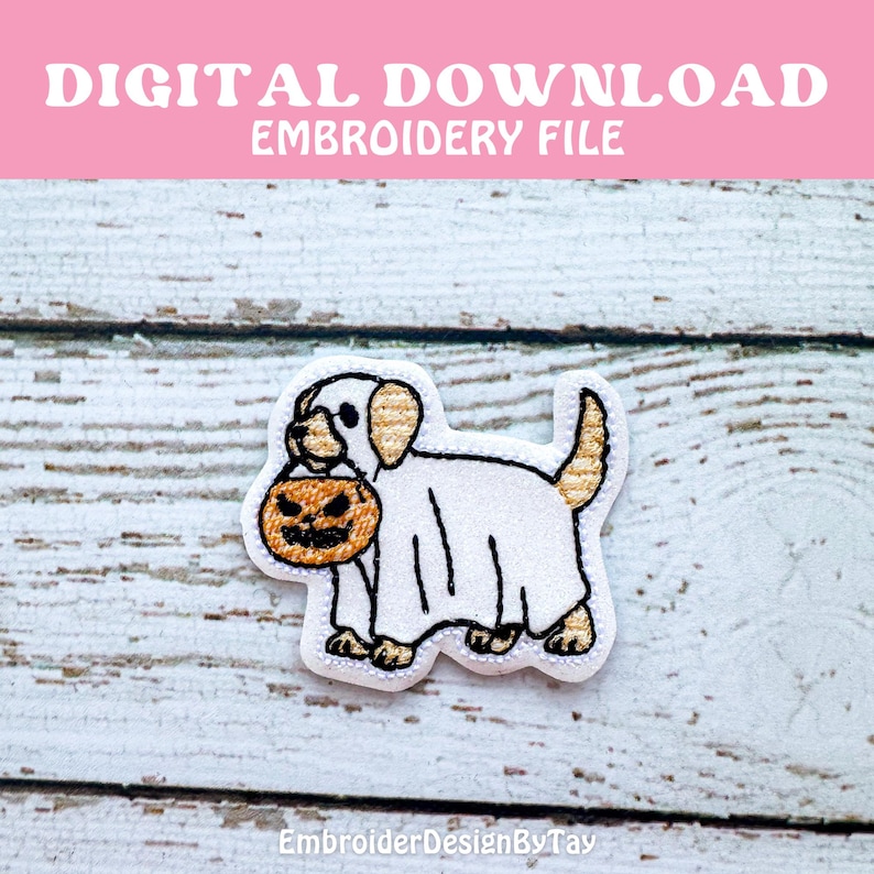May include: An embroidered patch featuring a cartoon dog in a ghost costume, holding a jack-o'-lantern. The patch has a white background with black outlines and tan accents. Text at the top reads "DIGITAL DOWNLOAD EMBROIDERY FILE". The bottom text reads "EmbroideryDesignByTay".