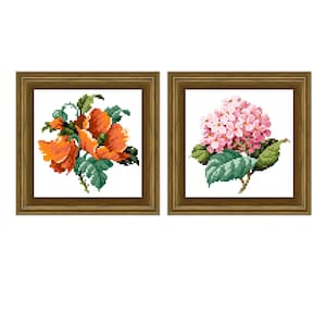 May include: Two framed cross-stitch embroidery pieces. The left frame shows a cluster of orange flowers with green leaves. The right frame shows a cluster of pink flowers with green leaves.