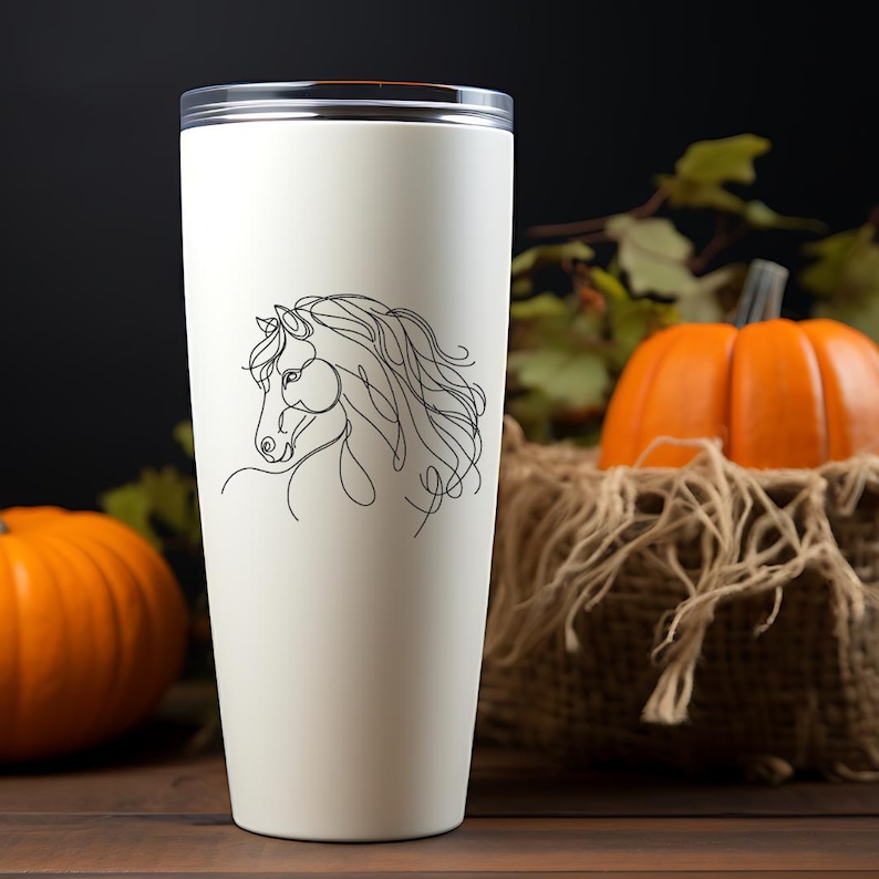 May include: White stainless steel travel mug with a black line drawing of a horse's head on the side.