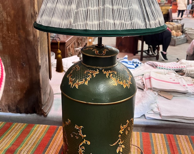 Large green toleware lamp with traditional brass fittings.