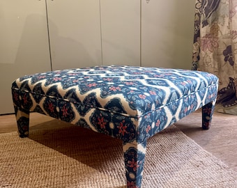 Bespoke footstool ottoman with fully upholstered legs in COM