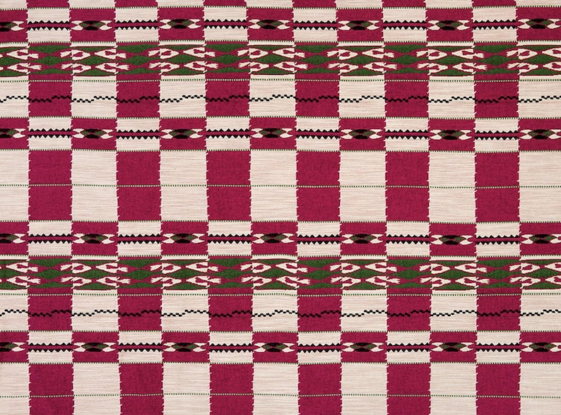 May include: A close-up of a woven textile with a repeating pattern of alternating vertical stripes in fuchsia and off-white. The design includes geometric shapes in green, black, and white, creating a textured, patterned fabric.