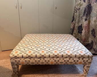 Bespoke footstool ottoman with fully upholstered legs in COM
