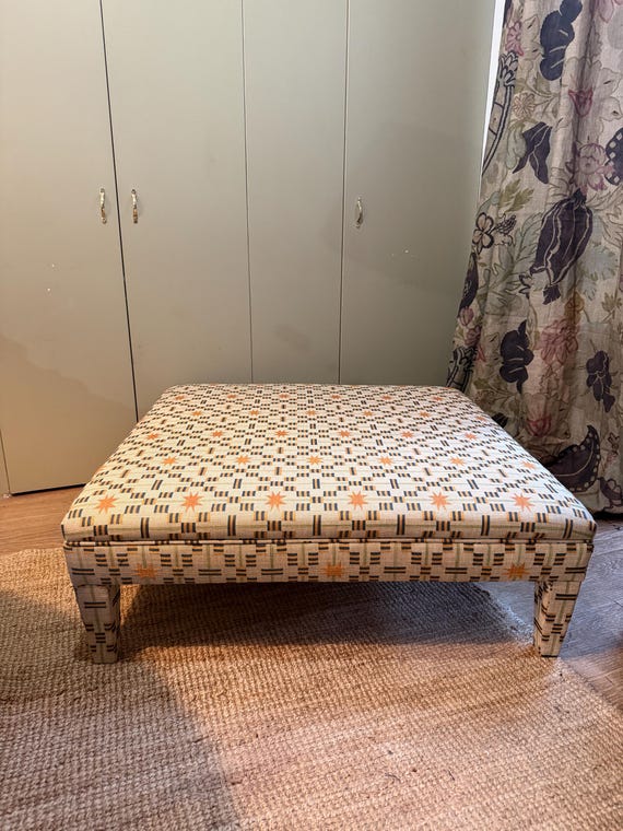 Bespoke footstool ottoman with fully upholstered legs in COM