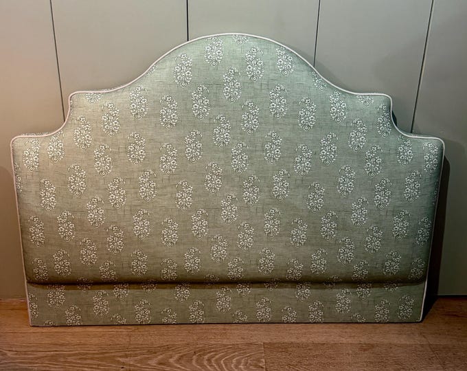 Bespoke upholstered headboard in a range of fabrics with piping