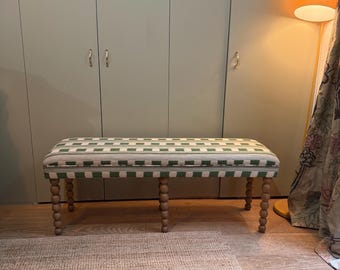 Christopher Farr Cloth bespoke upholstered bench in “Lost and Found” fabric by Kit Kemp with turned legs