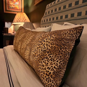 Large leopard print bolster cushions backed with green velvet (two available)