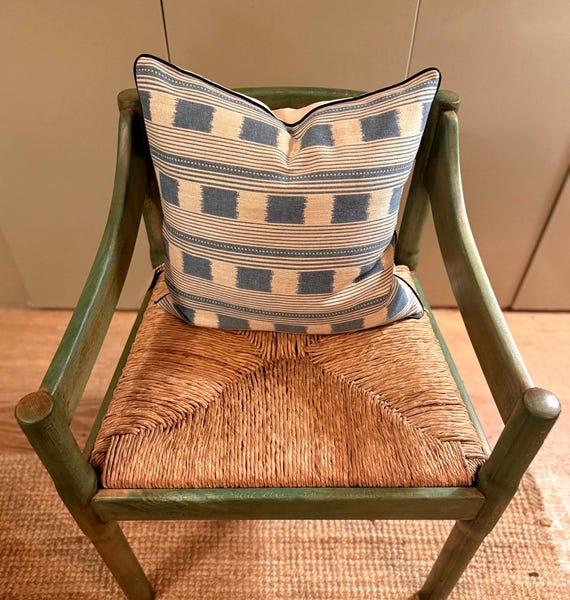 Handmade piped cushions in Christopher Farr Cloth Lost and Found by Kit Kemp