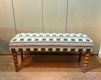 Christopher Farr Cloth bespoke upholstered bench in “Lost and Found” fabric by Kit Kemp with turned bobbin legs