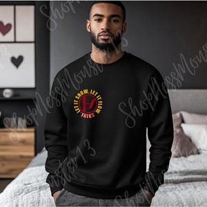 Lavish Capri Sun on black sweater