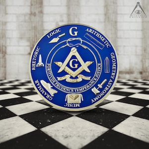 May include: A blue and gold Masonic emblem featuring the letter "G" at its centre. The emblem is encircled by a circle inscribed with the words "Logic", "Rhetoric", "Grammar", "Music", "Astronomy", "Geometry", "Arithmetic", and "Justice".