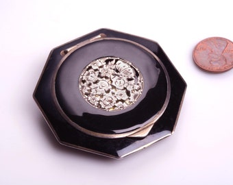 1920s Sterling Compact with Black Enamel:  Medallion of silver open work Flowers set into the lid .... and a photograph