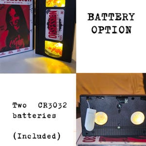May include: A black VHS tape modified into a lamp with internal yellow lights, featuring an Obsession movie label. The unit includes a battery pack for two CR3032 batteries. The text BATTERY OPTION and Two CR3032 batteries (Included) is visible.