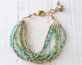 Aqua and gold multi strand bracelet