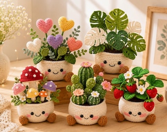 May include: Five crocheted potted plants with smiling faces on cream-colored pots. The collection includes heart-shaped flowers, a monstera plant, a mushroom cluster, a cactus with small flowers, and a strawberry plant with red berries and white blossoms.