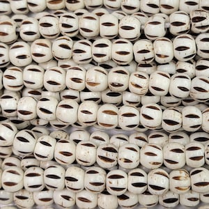 8x6mm Off White Water Buffalo Bone Rondelle Beads - 15 Inch Stand (AW8)