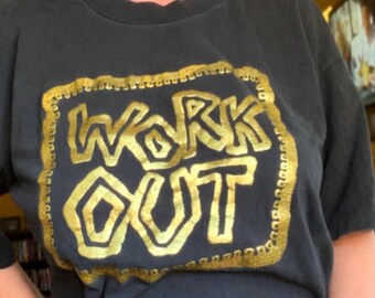 VIntage 80s/90s Work Out raised gold graphic on a Prin Temps tee